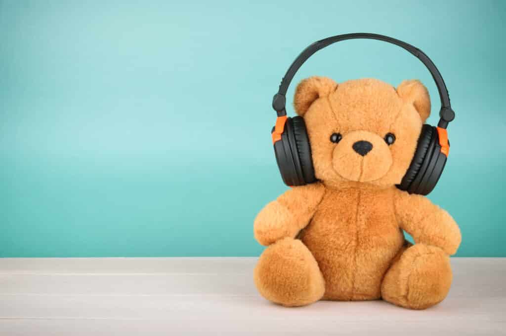 Teddy bear wearing noise-reducing headphones